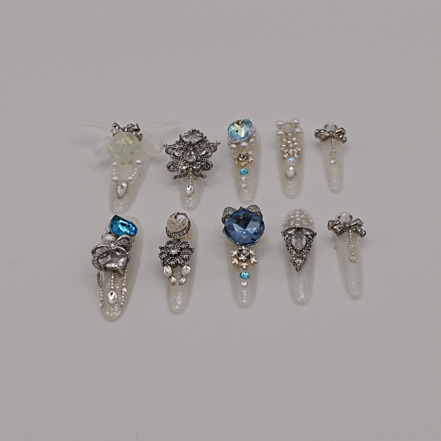 Frozen Queen Press-On Nails – White Glitter with Blue Crystals & Winter Charms