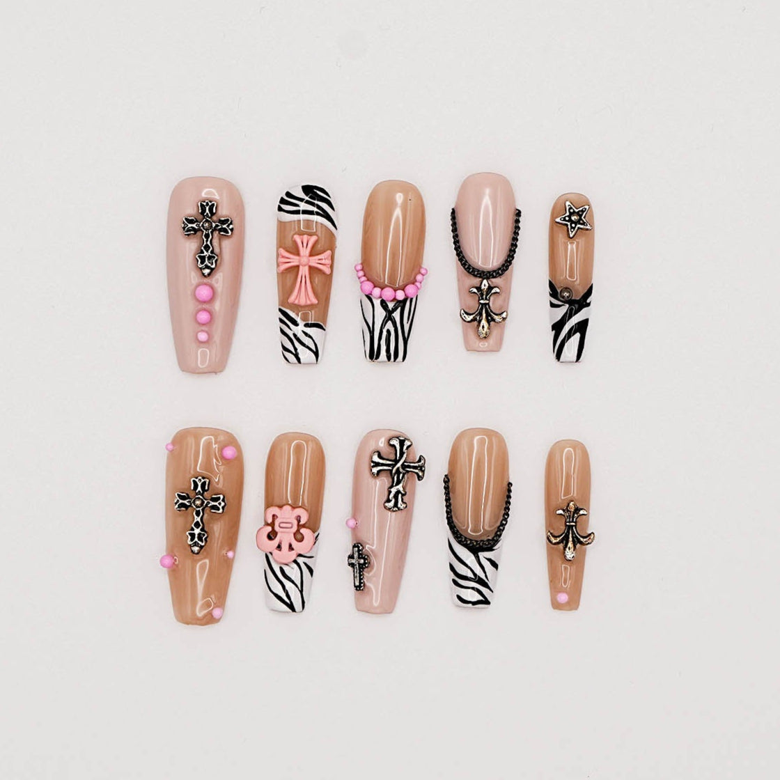 Zebra Punk Press-On Nails – Nude & Black Y2K Style with Cross Charms & Pink Accents