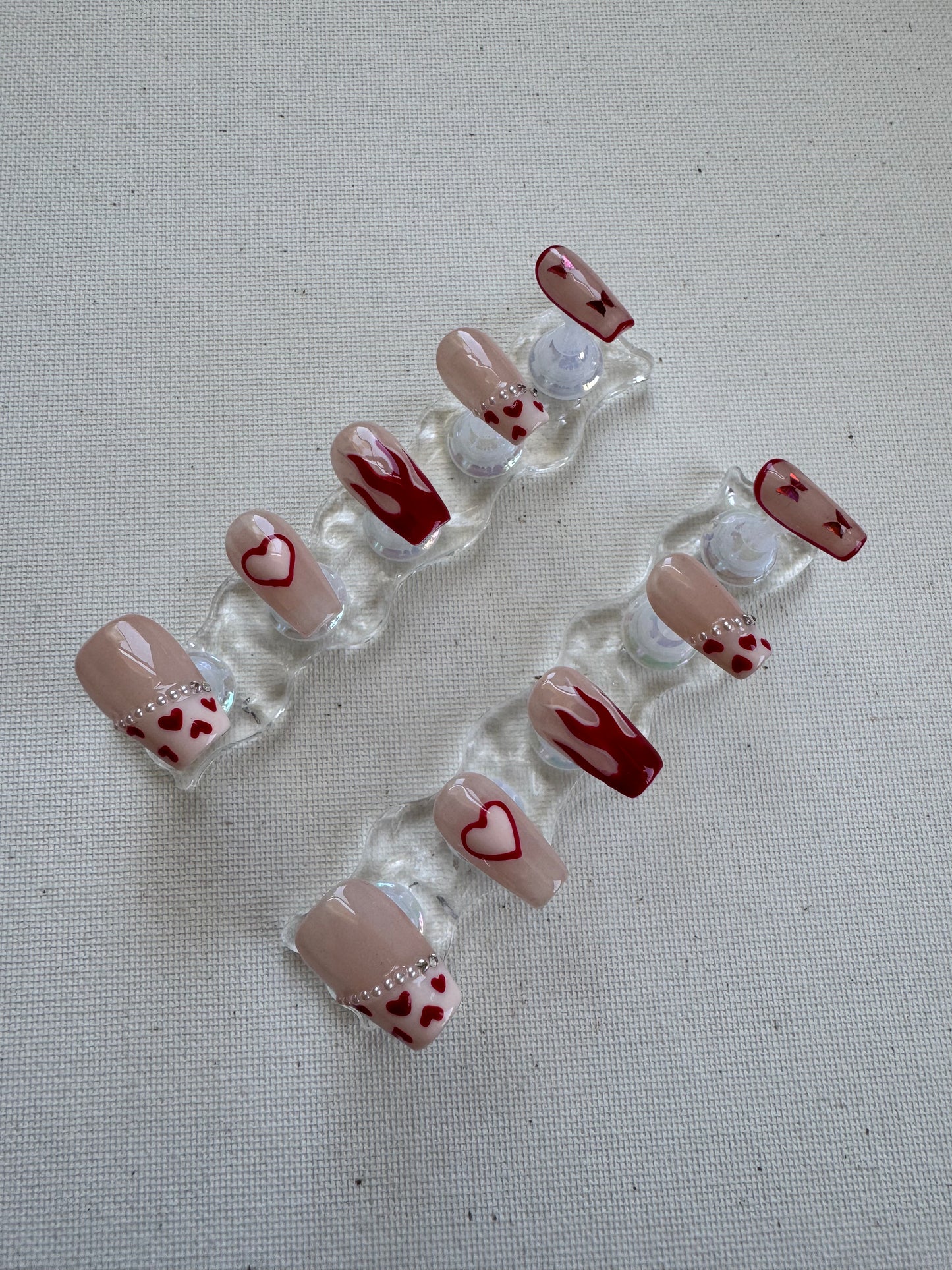Burning Sweet – Nude French with Flame Hearts & Butterfly Charms