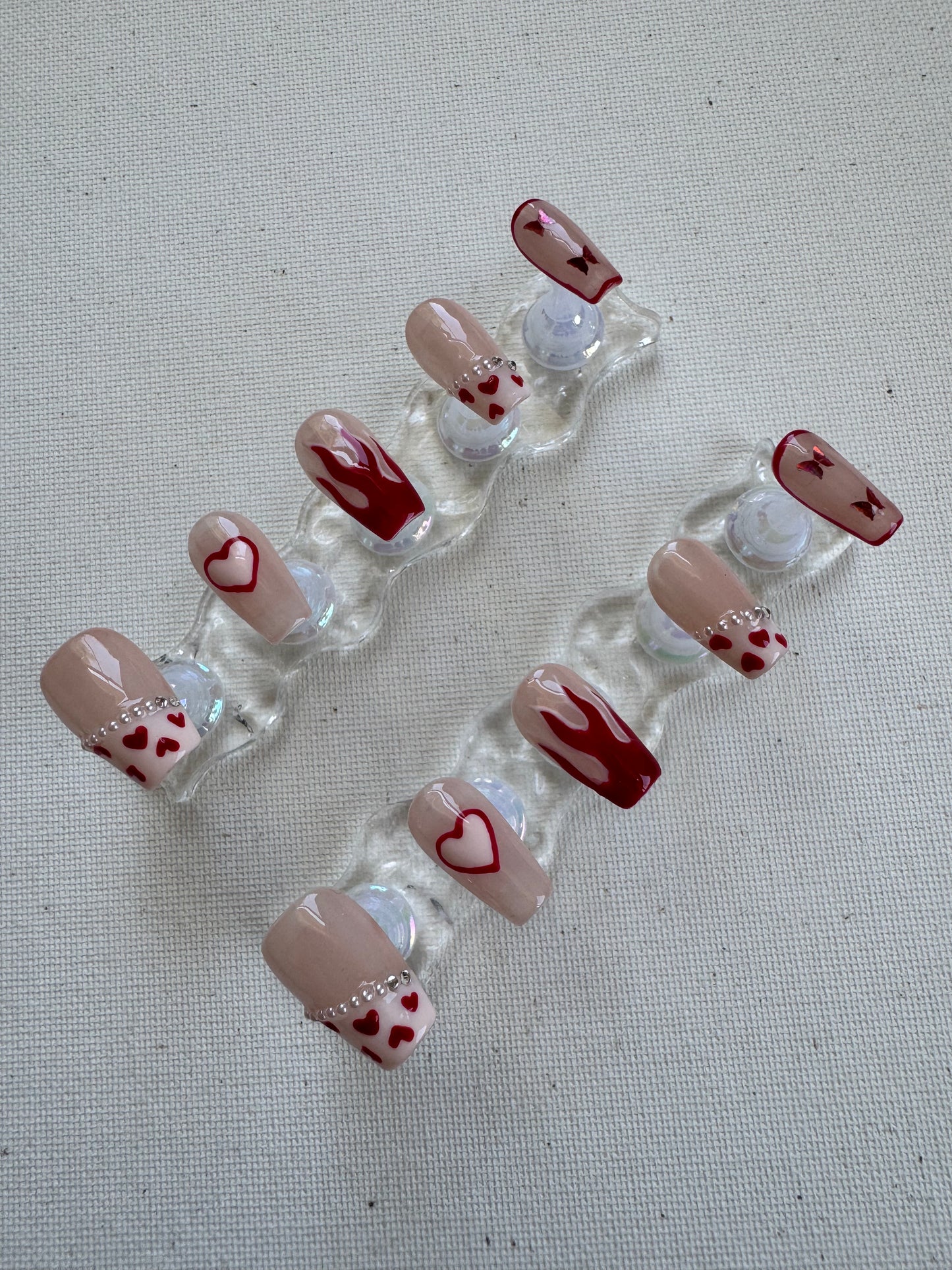 Burning Sweet – Nude French with Flame Hearts & Butterfly Charms