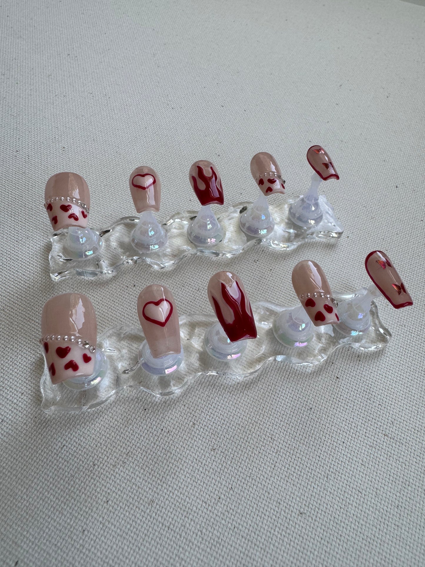 Burning Sweet – Nude French with Flame Hearts & Butterfly Charms
