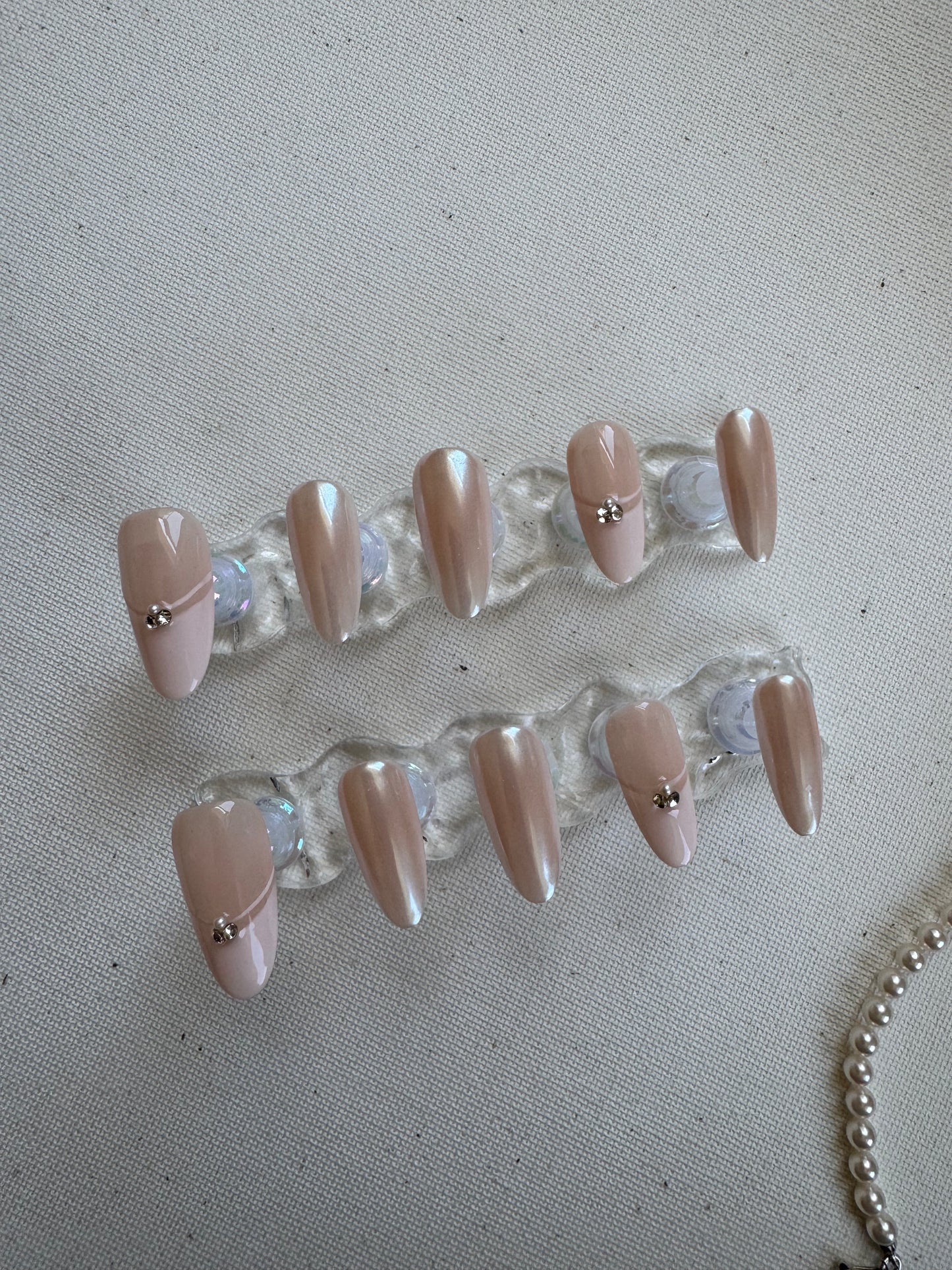 Elegance Touch – Nude French with Sparkling Gems