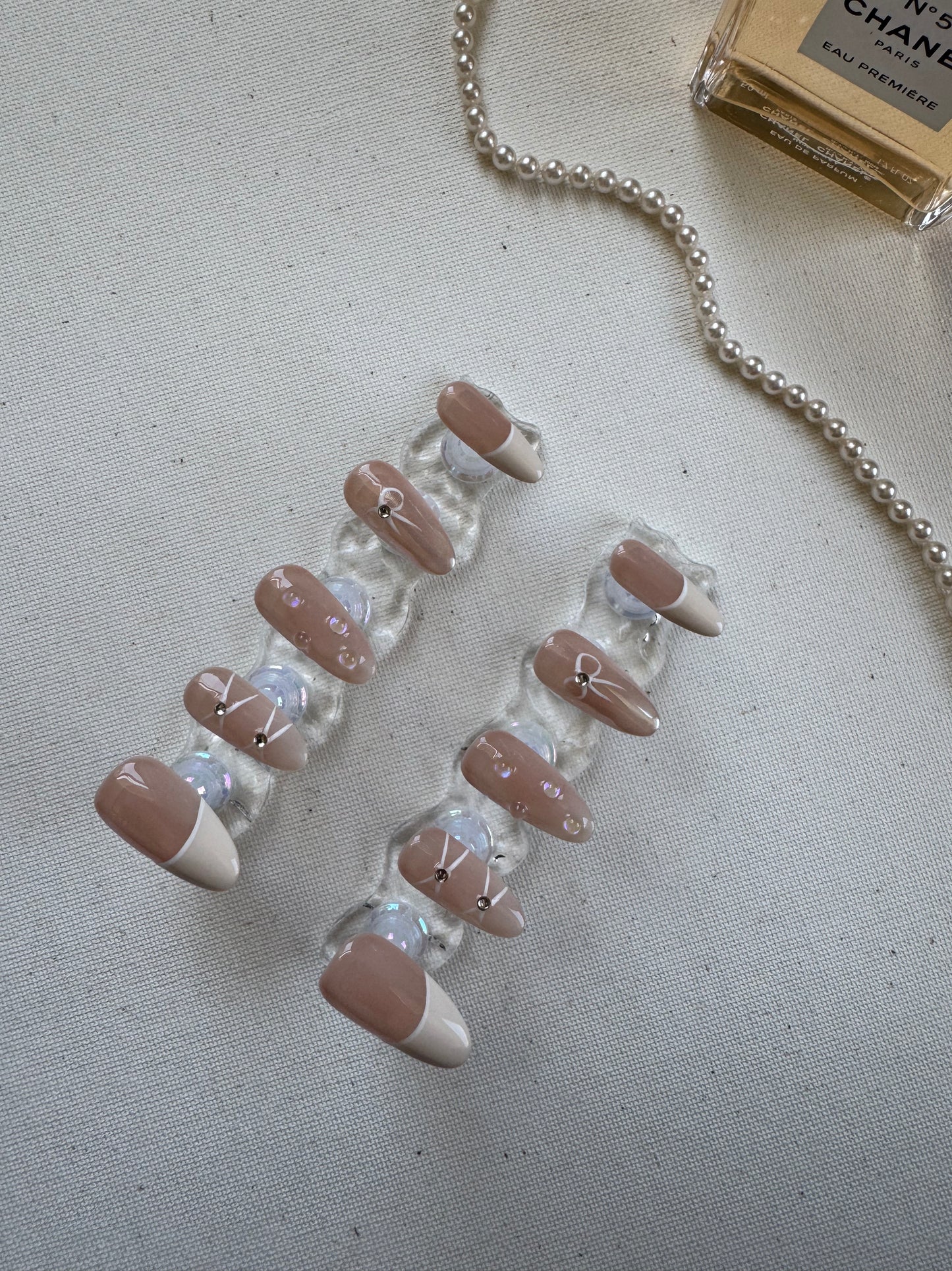 Dewdrop Kiss – Nude French with Bow and Waterdrop Accents