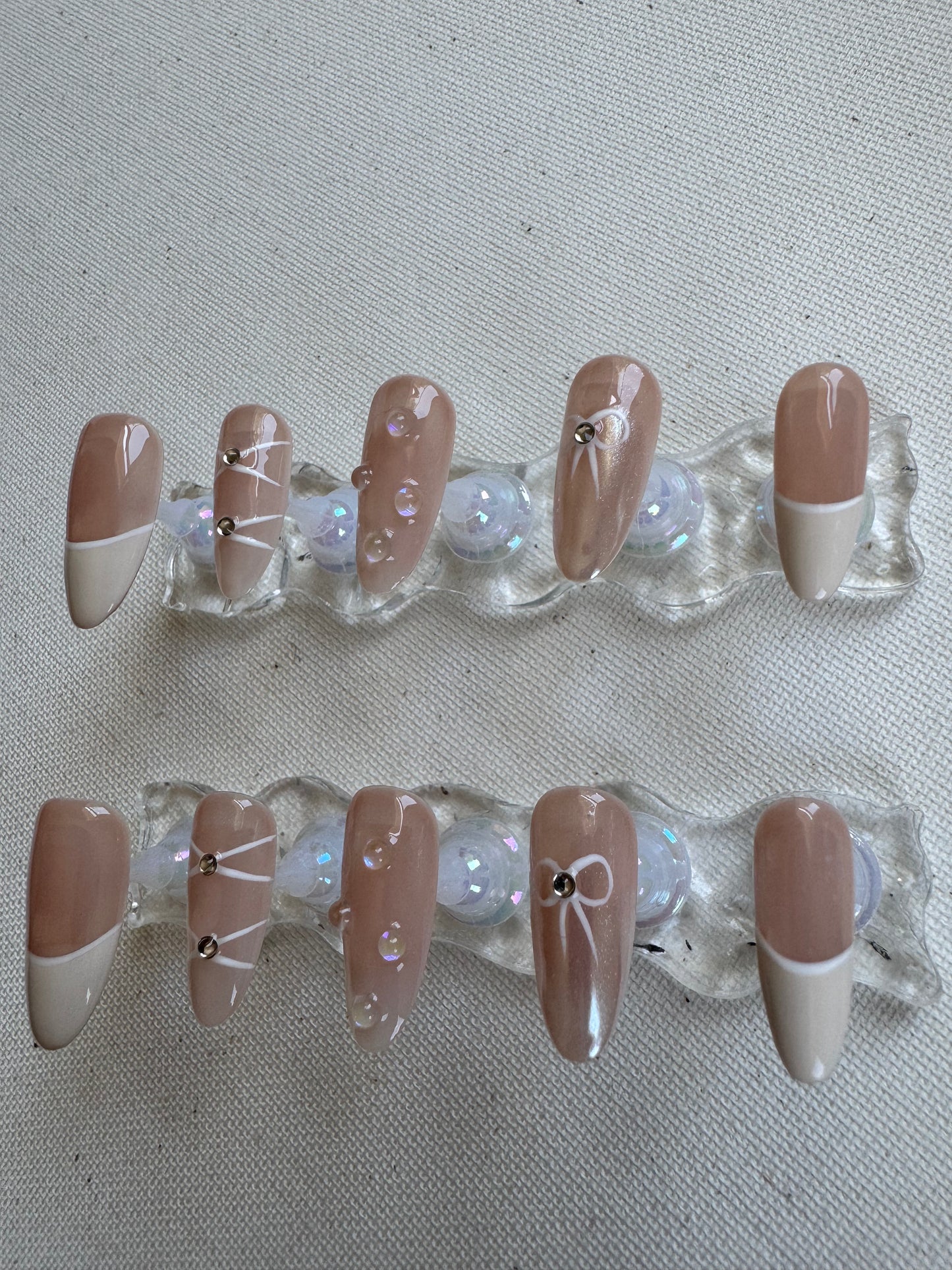 Dewdrop Kiss – Nude French with Bow and Waterdrop Accents