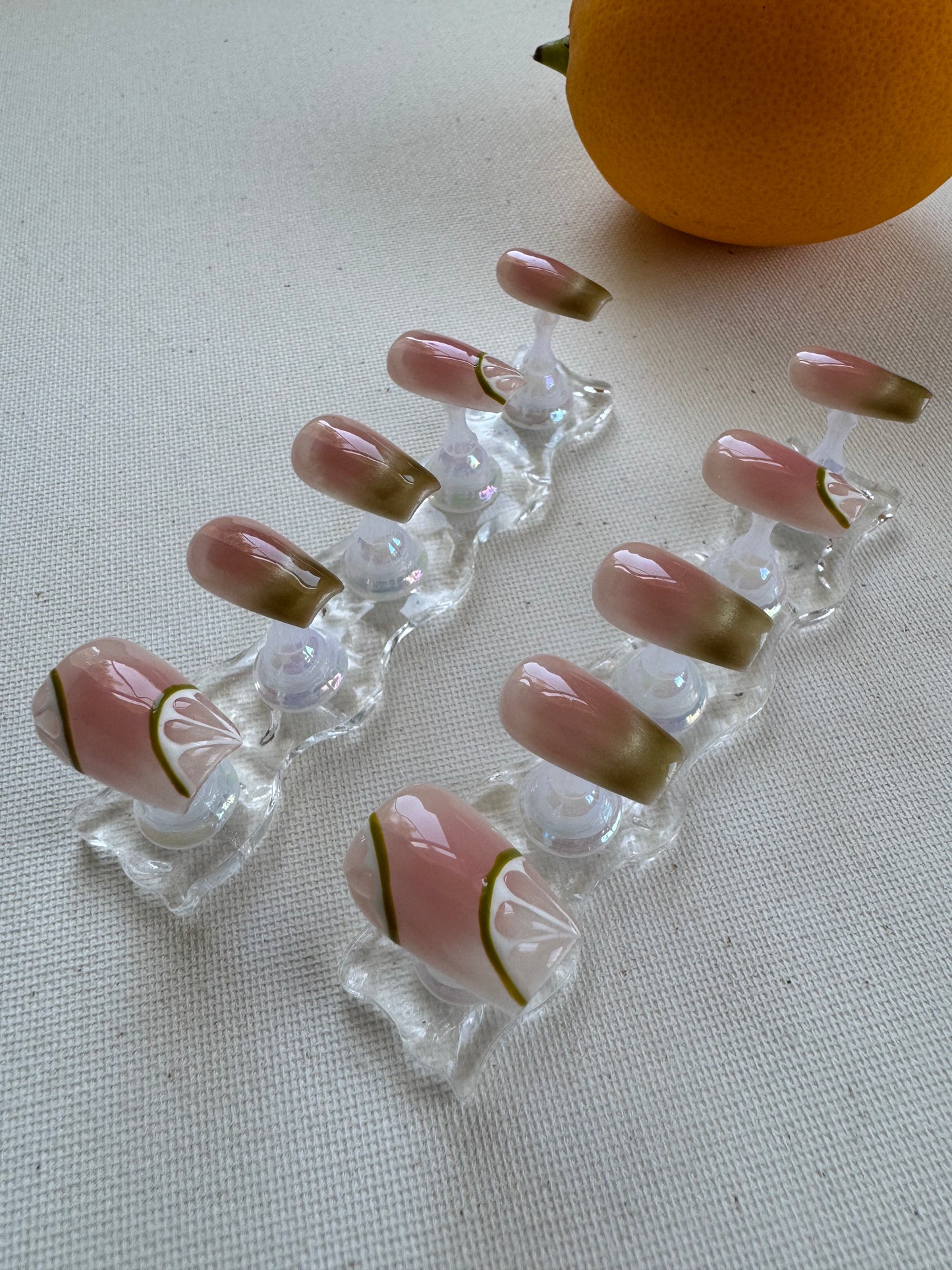 Painted summer lime nude wearing armor press on nails