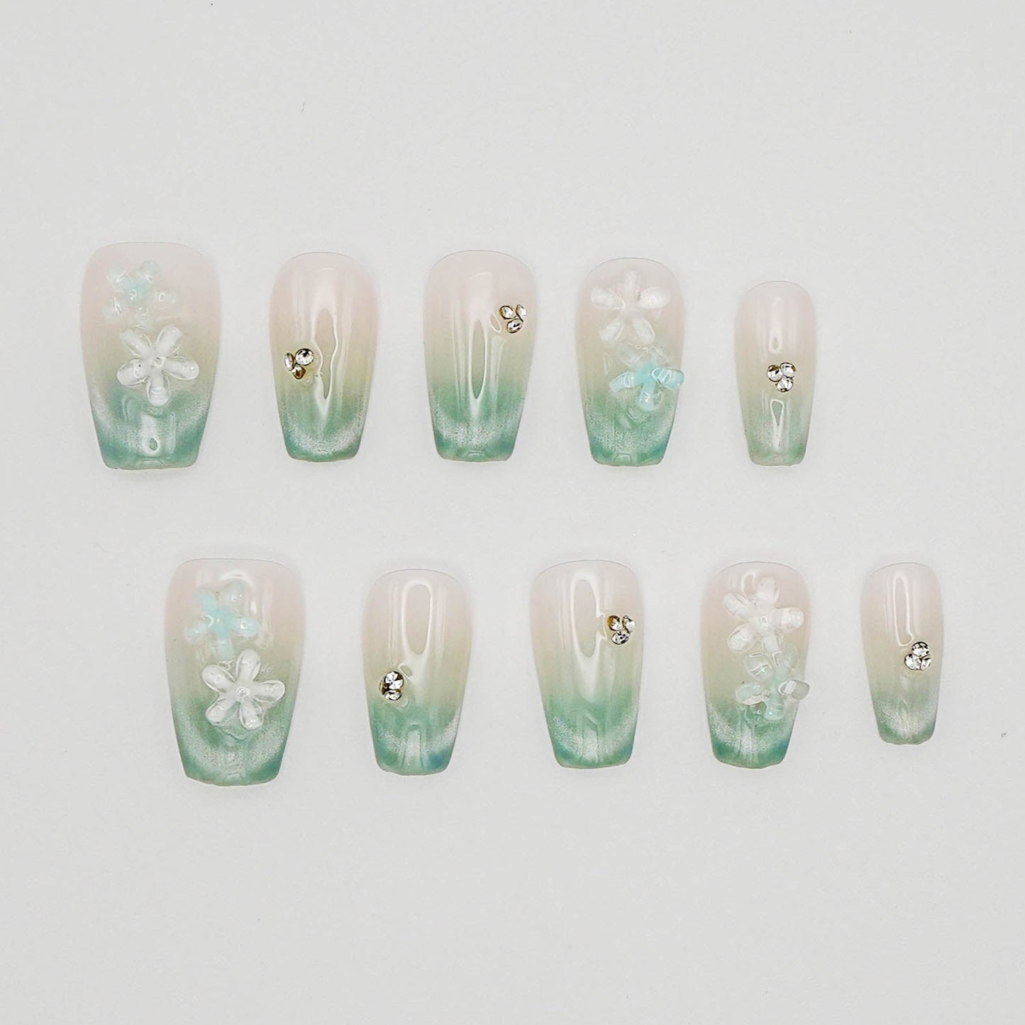 Floral Dew – 3D Blossoms on Pastel Green Crystal With Cat Eye Nails