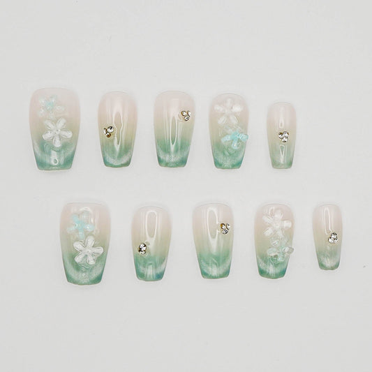 Floral Dew – 3D Blossoms on Pastel Green Crystal With Cat Eye Nails