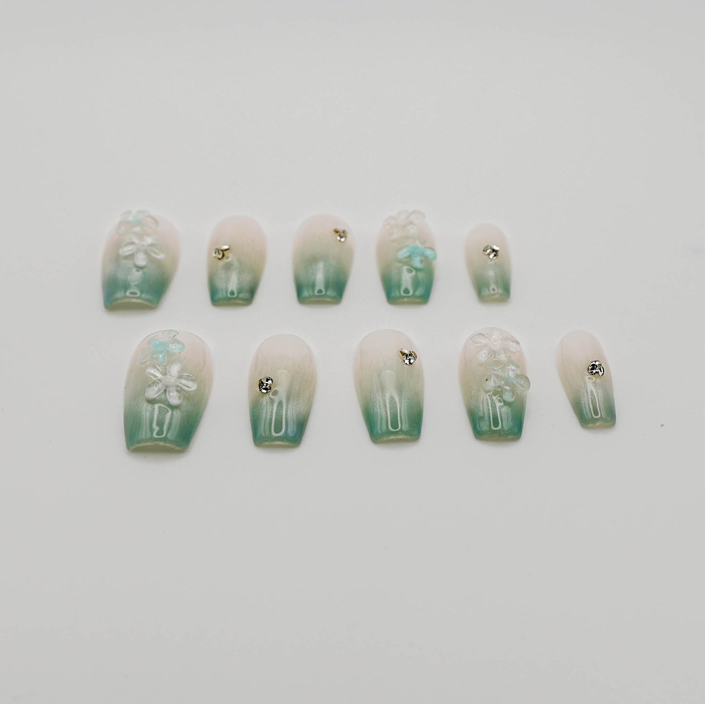 Floral Dew – 3D Blossoms on Pastel Green Crystal With Cat Eye Nails