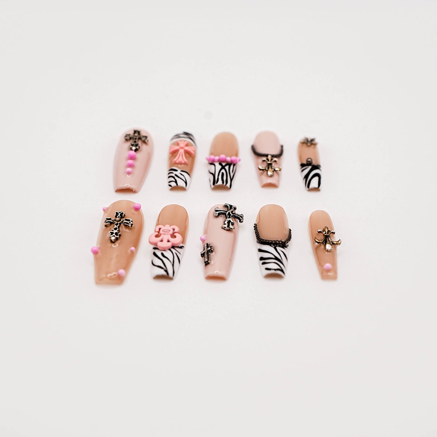 Zebra Punk Press-On Nails – Nude & Black Y2K Style with Cross Charms & Pink Accents