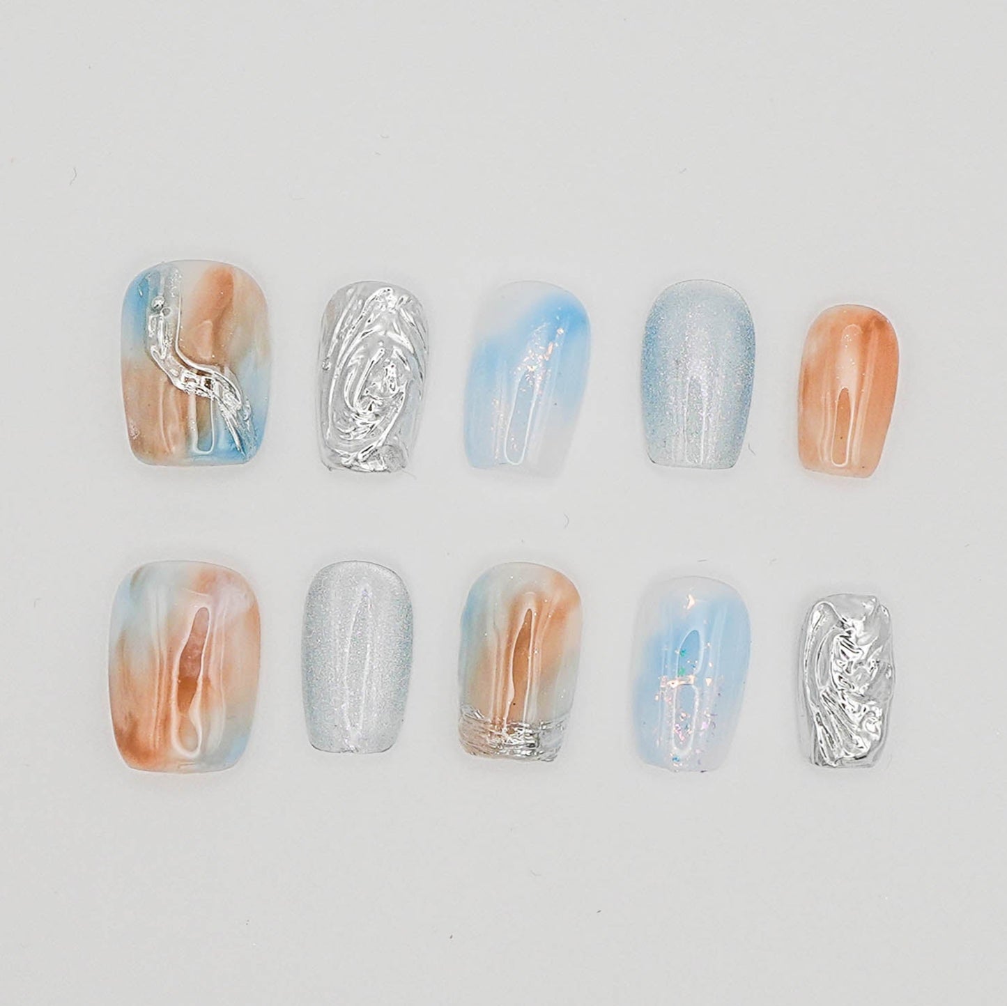Tidal Light – Nude & Blue Chrome Cat Eye Nails with Water Ripples