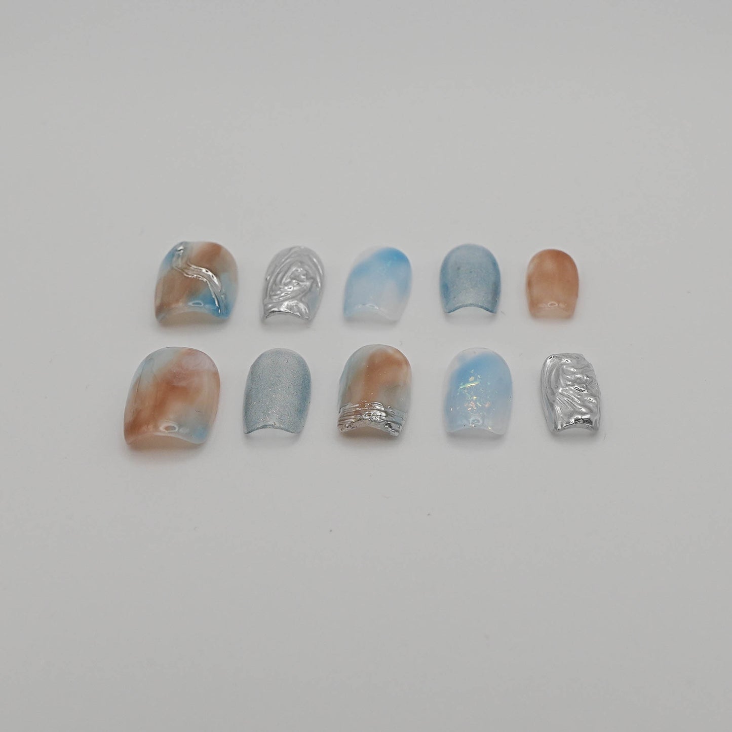 Tidal Light – Nude & Blue Chrome Cat Eye Nails with Water Ripples