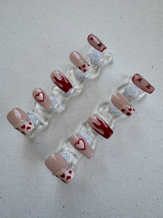 Burning Sweet – Nude French with Flame Hearts & Butterfly Charms