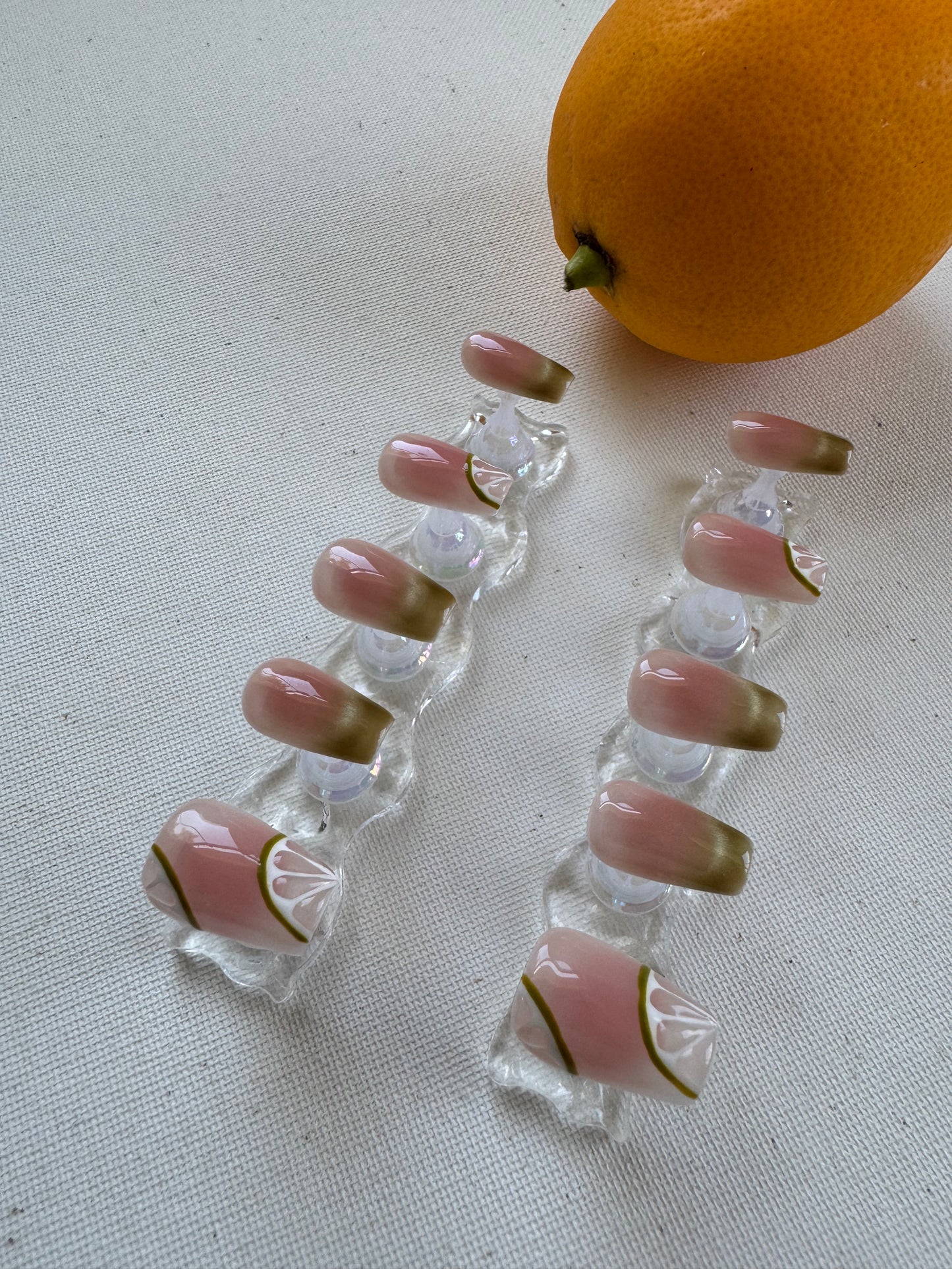 Painted summer lime nude wearing armor press on nails