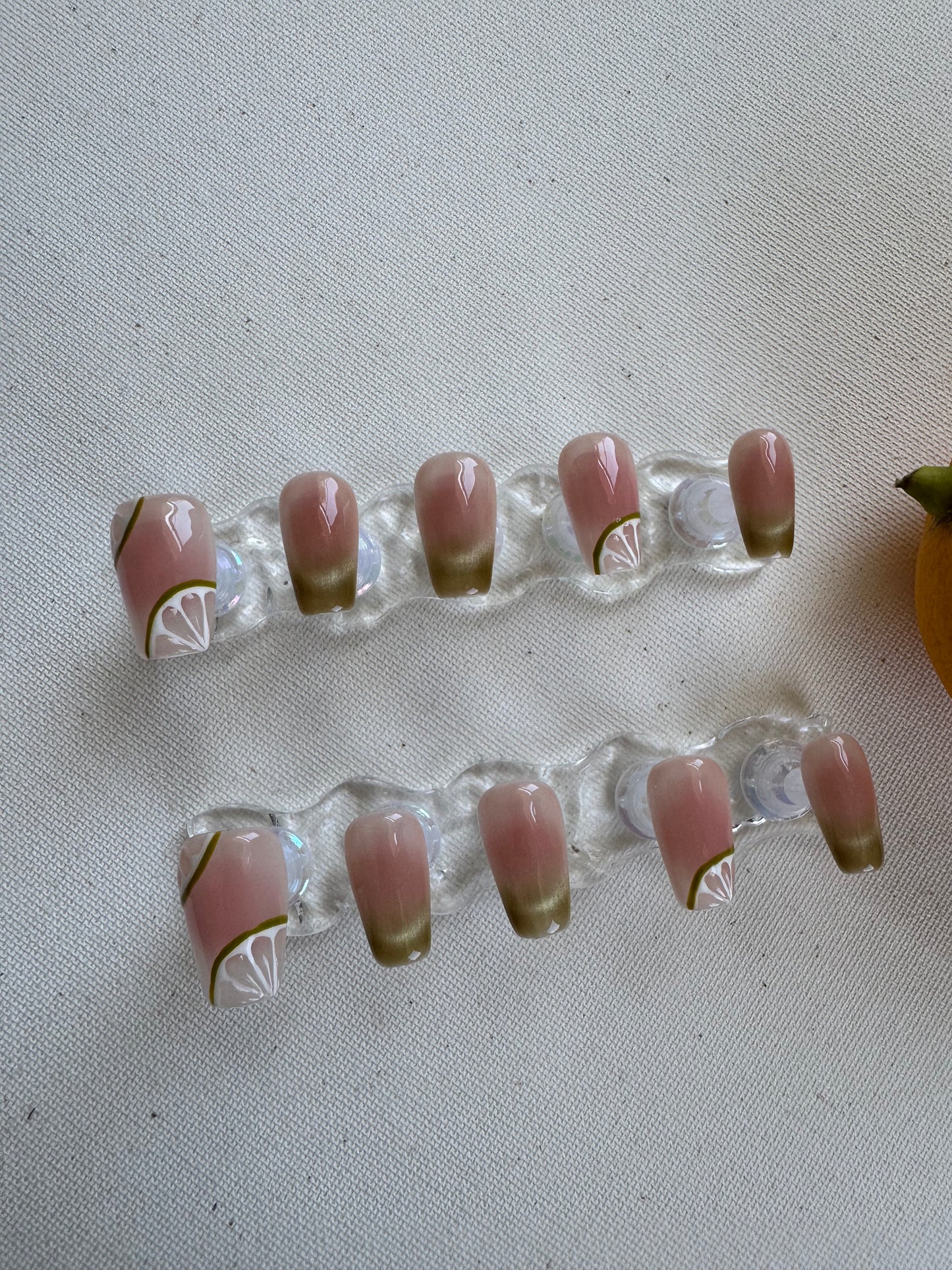 Painted summer lime nude wearing armor press on nails