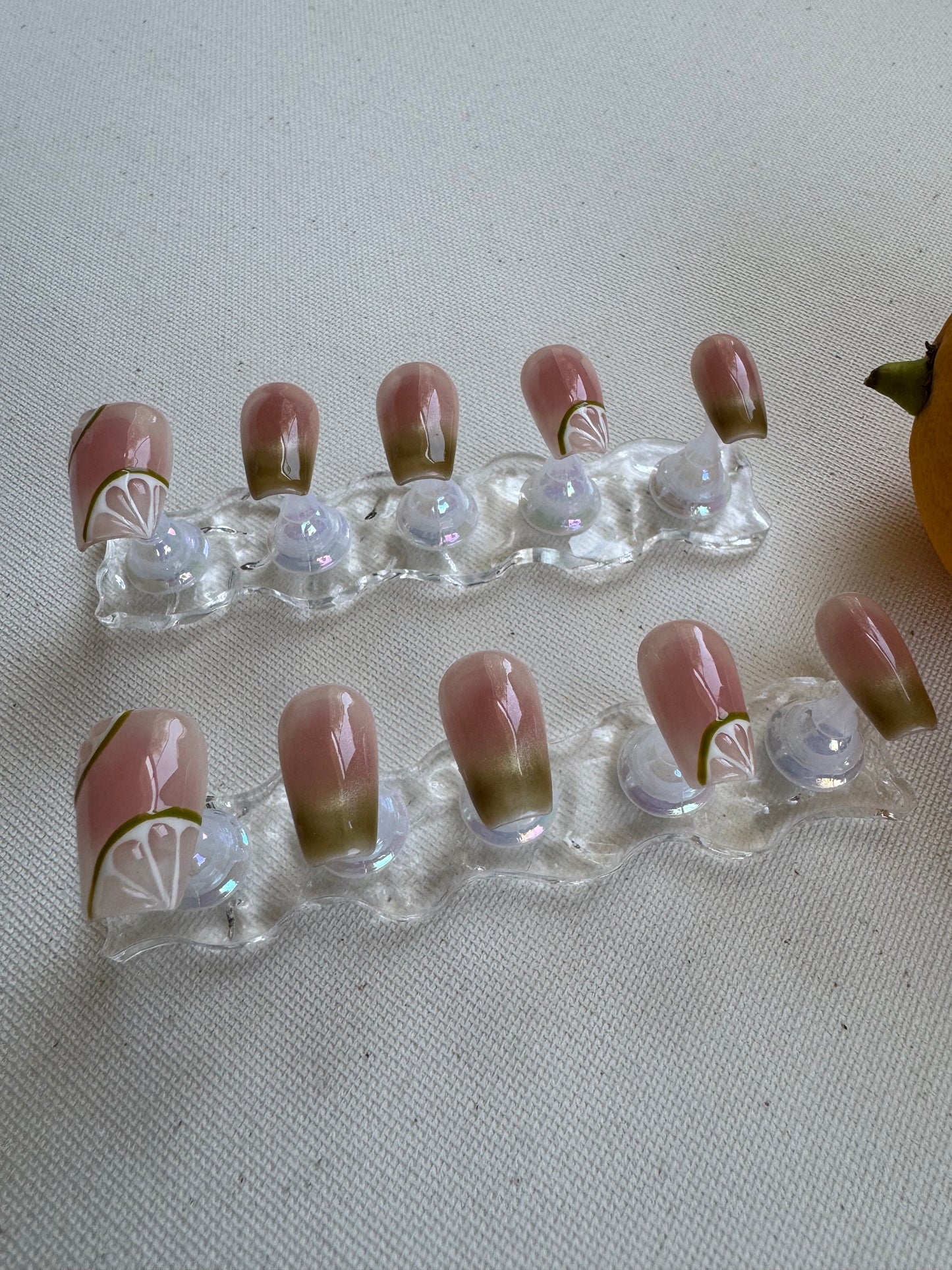 Painted summer lime nude wearing armor press on nails