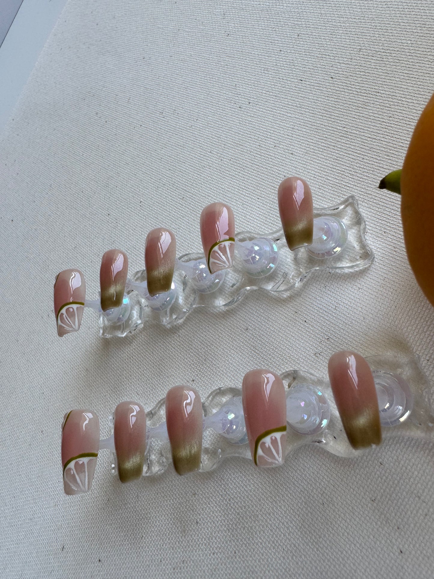 Painted summer lime nude wearing armor press on nails