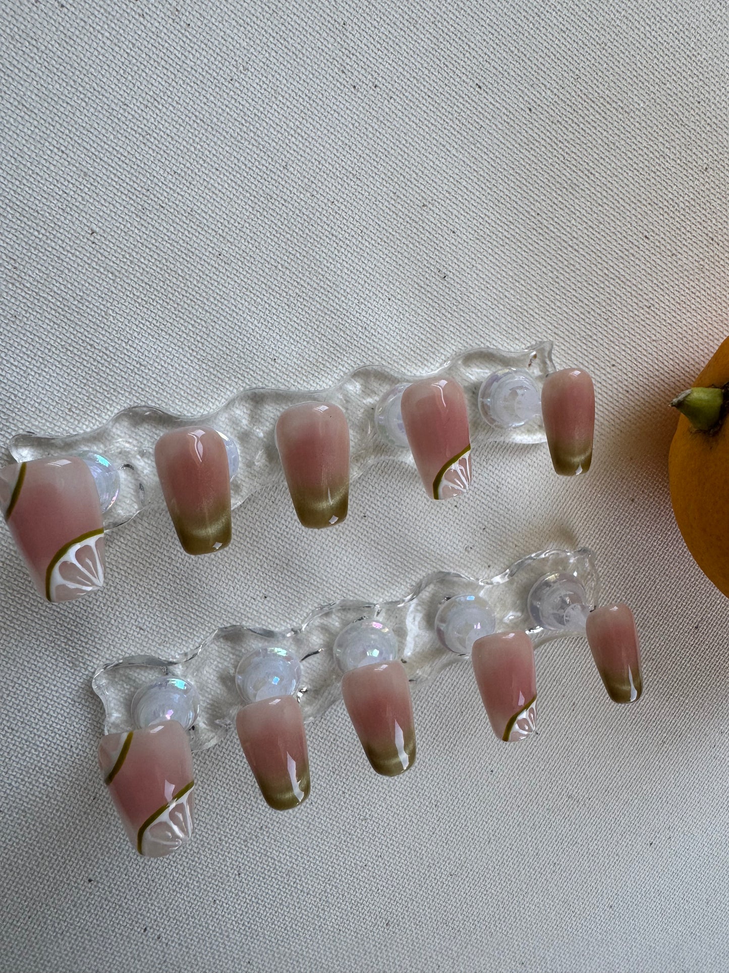 Painted summer lime nude wearing armor press on nails